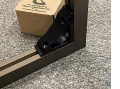 Photo of a real AngleLock corner bracket assembled on a 40x40 extrusion profile during testing